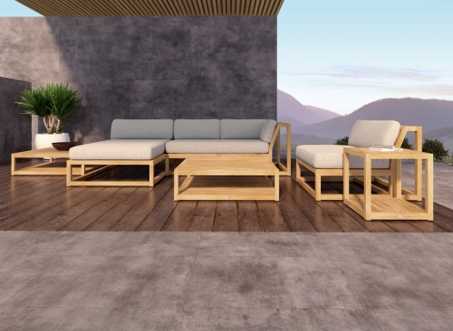 70231 Maya Deep Seating 6 piece teak Lounge Set with cushions with books and potted succulent plant water glasses and candle lantern facing pool with house in background