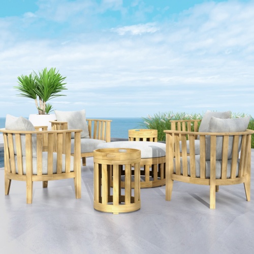 Kafelonia 7 piece Lounge Set with marine gloss finish  two cushioned teak storage bins on a boat deck with American flag on back of boat on water