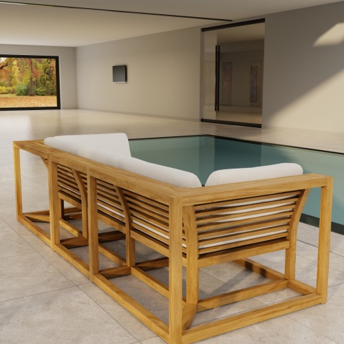 70277 Maya Deep Seating Sofa of Maya Right Side Sofa Sectional and Corner Sectional in angled end view on patio next to glass door of house with fence and trees in background
