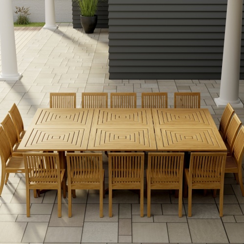  70288 Pyramid Teak Dining Set for 16  in angled view of table top on covered patio with house window and wood door in the background