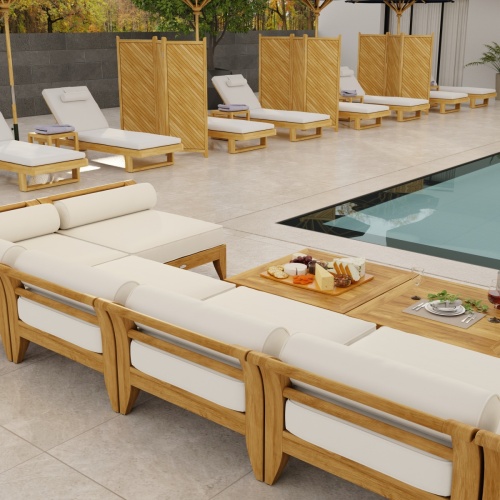 70348 Aman Dais 9 pc Lounge Set with bolsters and cushions aerial back view facing a pool with glass doors and house in background