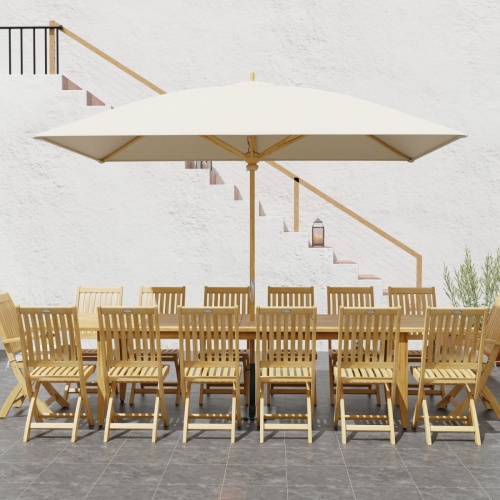 70351 Laguna Barbuda 15 pc Dining Set of 14 dining armchair and rectangular 11 foot extendable dining table with optional umbrella side view on patio with staircase in background