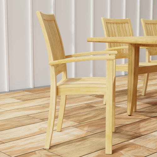 70774 Laguna Sussex 9 pc Teak Dining Set showing closeup end view on wood deck with house in background