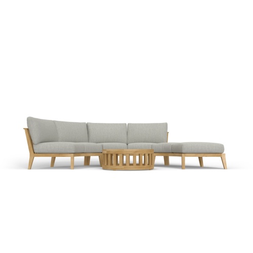 70934 Kafelonia 4 piece Curved Sofa Sectional Set front view on an outdoor patio in angled front view with ocean in the background