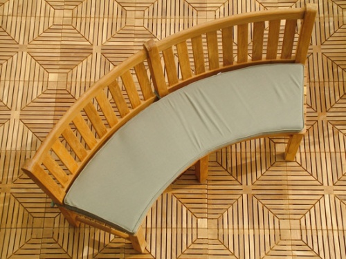 Image of 73852MTO Stone Green color cushion for Buckingham Curved Bench on teak tiles overhead view