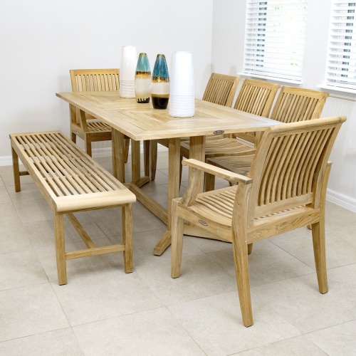 13917 Laguna 6 foot teak Backless Bench on concrete walkway with grass in background