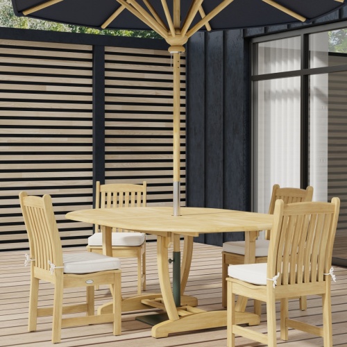 70031 Martinique Veranda 5 pc Dining Set of Martinique Oval Teak Table and 4 Veranda Side Chairs with optional round umbrella on wood deck with glass door and building in background