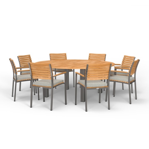70111 Vogue teak and stainless steel 9 piece72 inch round Dining Set with a vase and a teak tray with a pitcher and 2 glasses in angled view of table top on marble stone patio