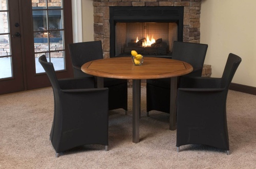 70236 Vogue Apollo 5 piece Dining Set of 4 armchairs in tobacco colored textilene fabric and a teak and stainless steel 4 foot round table with 3 lemons on table in front of fireplace  