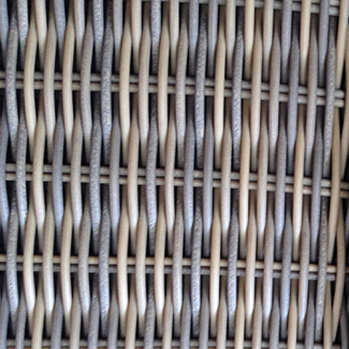 70262 Valencia Wicker dining set close up view of wicker weave on white background