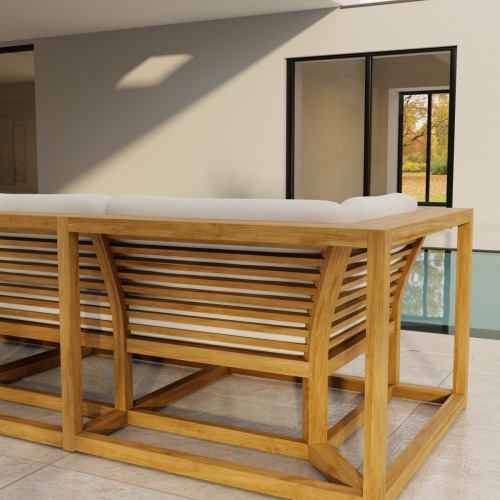 70277 Maya Deep Seating Sofa of Maya Right Side Sofa Sectional and Corner Sectional in angled back view on patio facing pool next to glass door of house with  trees in background