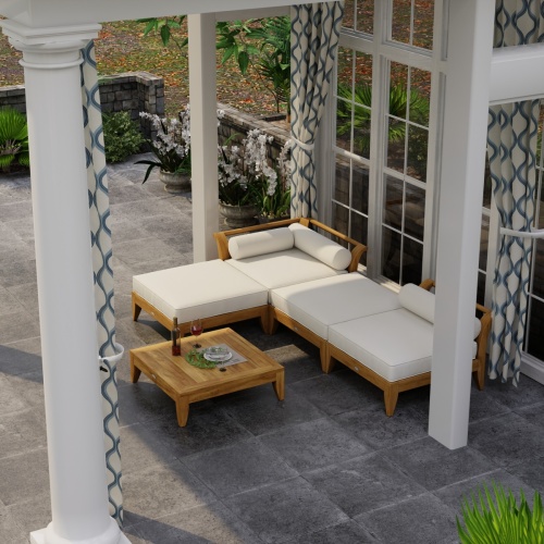 70281 Aman Dais 4 pc Lounge Sofa Set in angled aerial view under a covered pergola with pool and trees in background 