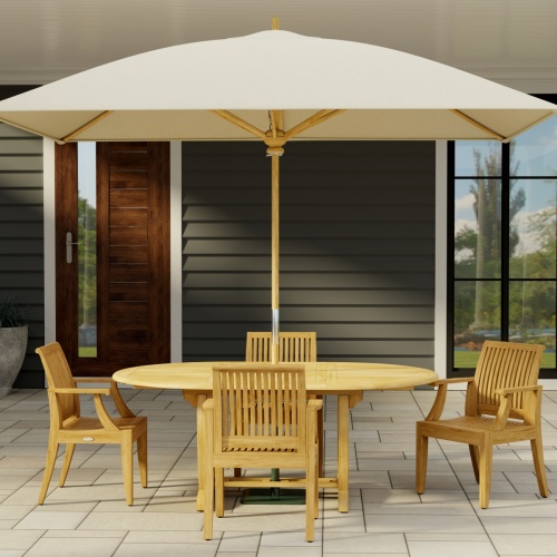 70305 Martinique 5 piece Dining Set  angled end view on stone patio with 3 pillars and pool and trees and privacy wall in the background  