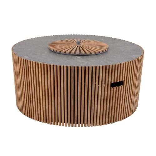 14100 Agora Round Fire Table angled view with lake in background and boat going by with sunset bacground