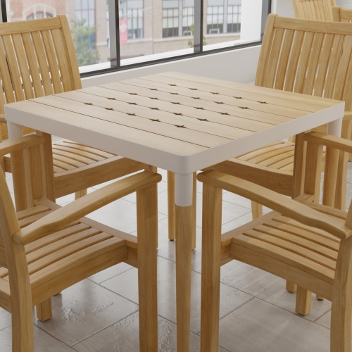 70387 Bloom Sussex 5 pc Dining Set showing closeup of Bloom teak and powder coated aluminum 32 inch square dining table corner angled view with windows in background