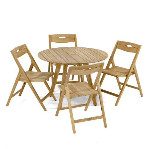 70519 Surf 5 piece teak round Dining Set with fruit bowl in center and 2 potted plants teak loveseat 2 poofs white coffee table with vase and glass sliding doors and ocean in background