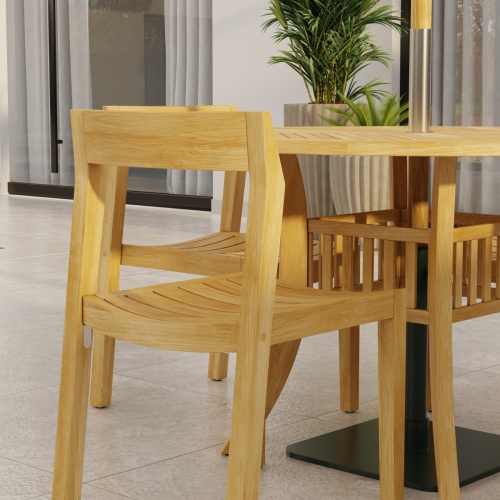 70573 Grand Hyatt Horizon Dining Set showing partial side view on patio with potted plants and glass door in background  