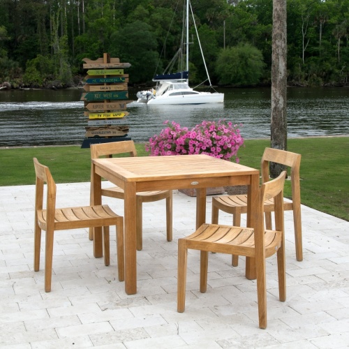 70498 Horizon Sidechair Dining Set for 6 on stone patio with house windows in background