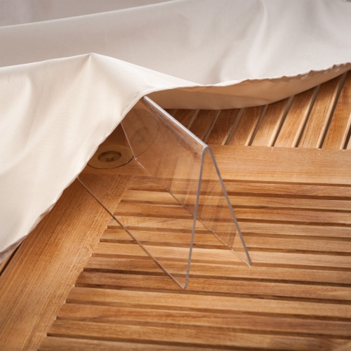 67112 Somerset Bar Cover showing closeup of bottom hem of cover on teak table