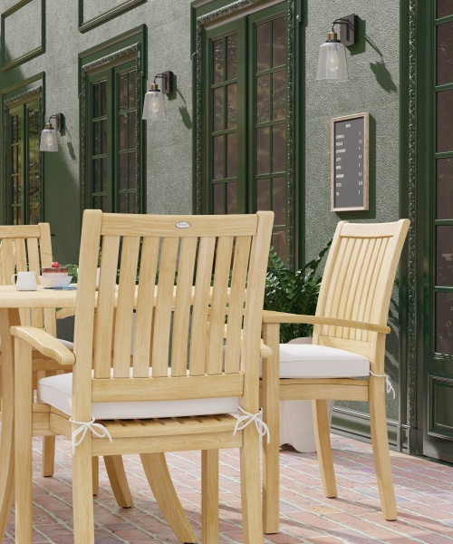 70027 Grand Hyatt 5 pc Dining Set on brick patio with optional seat cushions outdoors aerial view next to potted plant and glass entry door to the side