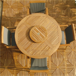 70030 Grand Hyatt SS Kelly Dining Set of a 48 inch round dining table with optional teak Lazy Susan in center and 4 SS Kelly dining chairs aerial view on teak tile flooring background