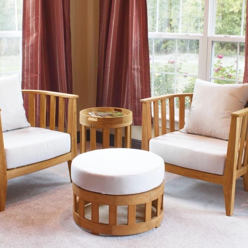 70239 Kafelonia 4 pc Lounge Set on indoor rug with laguna dining set on left and Laguna loungers and ocean in distance