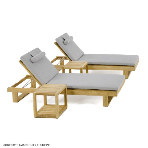 70309 Horizon teak double chaise set with cushions left side angled on concrete deck with metal railing trees boathouse and dock in background