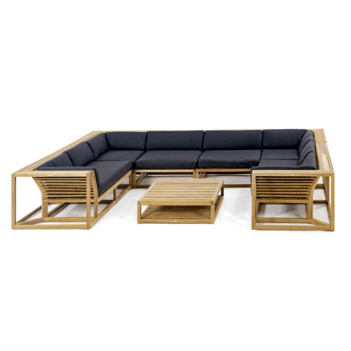 70754 maya seven piece lounge teak set of a Left and Right Sectional and 2 Slipper Chairs and 2 Corner pcs and Ottoman Coffee Table with black colored cushions angled view on white background     