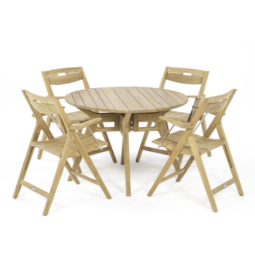 70804 Surf Marine Grade 42 inch round Folding Dining Set for 5 with potted plant on wood tray and drinking glass on table top with trees and landscape plants in background