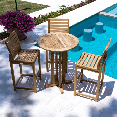 11812 Somerset Side Barstool on concrete patio next to pool with flowering plant in pot grass area and concrete walkway in background