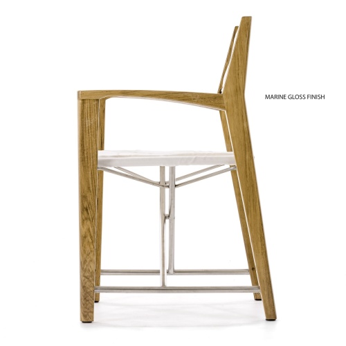 12915F Odyssey Folding Director Chair in marine gloss finish right side angled front facing view on sandy beach by boulder with ocean and blue sky in background