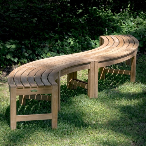 13937 Buckingham Picnic Dining Set with white bowl of grapes 4 white plates stacked and 4 glasses on table top set on grass field angled aerial view with trees in background