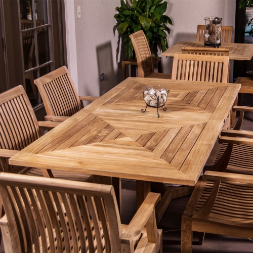 70422 7 piece Pyramid Teak Dining Set on teracotta patio with french doors on left