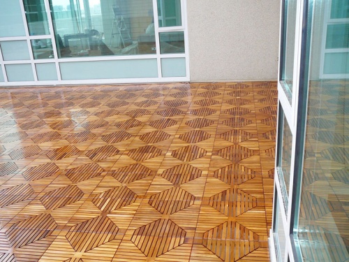 18408 diamond teak tile installed on indoor floor with large glass window in background