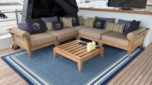 70121 Aman Dais 6 piece sectional set angled aerial view on area rug on a yacht deck 