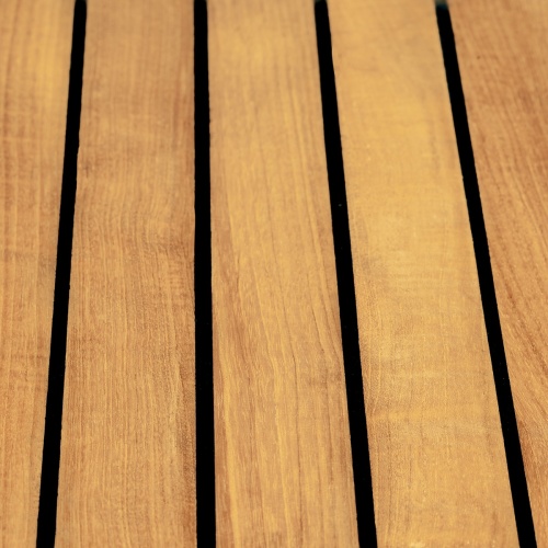 25190 Vogue 36 inch Square Teak and 304 Stainless Steel Dining Table showing closeup view of table top with sikaflex sealant between the slats