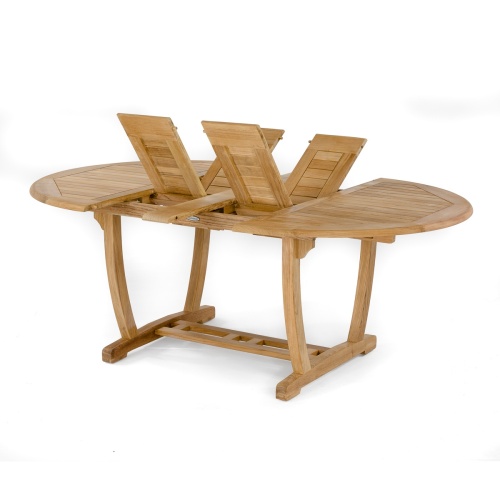 70079 Oval teak dining extendable table angled side view showing double butterfly leaf extensions folded outward in v on white background