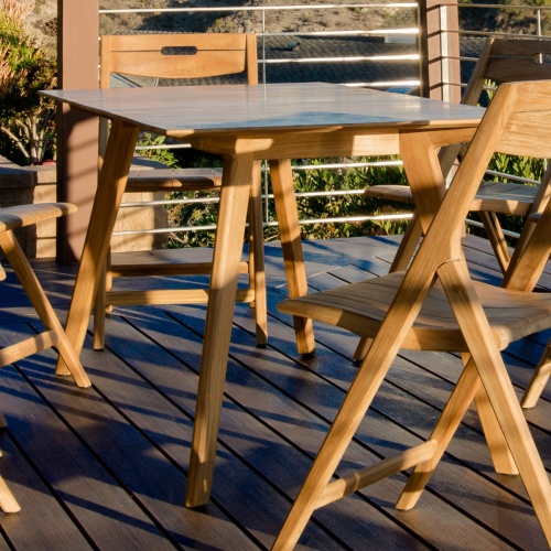 70518 Surf teak 7 piece folding Dining Set angled view on wood deck overlooking homes in background