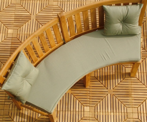 71000MTO Solid Color Throw Pillow two in stone green color top view on cushioned curved teak bench with back on teak tiled floor