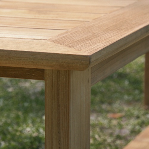 13909 Horizon teak 6 foot long Backless Bench closeup corner of bench on grassy area