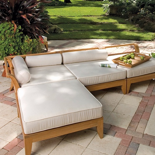 16767dp aman dais teak sectional ottoman fill teak base bottom leg showing black chair glide on a white background