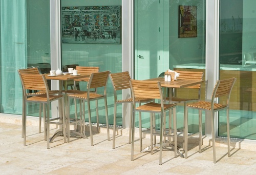 25313 Vogue High Bar Set showing salt and pepper napkins holder teapot and 3 cups sugar bowl on concrete patio with glass sliding doors interior room 2 paintings view in background