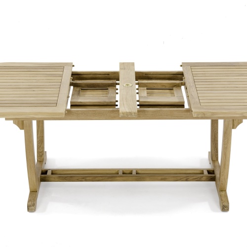 15504 Montserrat Teak Oval Table closeup view of double butterfly leaf extensions storage area on white background