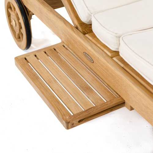 70510 Somerset teak double chaise with optional cushions closeup view of teak pull out sliding tray and rubberized wheel on white background