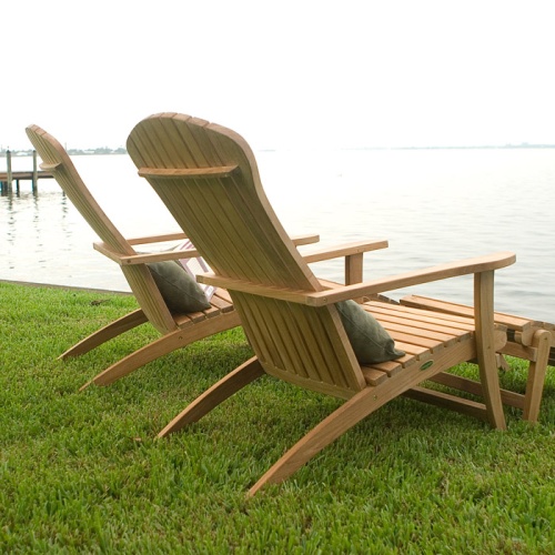 70000 two Adirondack Chair with footrest and cushions angled view of chair back on green grass overlooking a lake