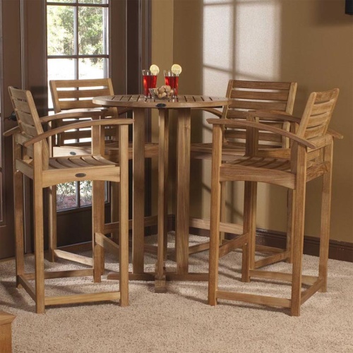 70249 Somerset 5 piece Backless Bar Set on carpet interior room with 2 glasses of ice tea with lemon slices on glass rim on table in front of windows with outdoor view