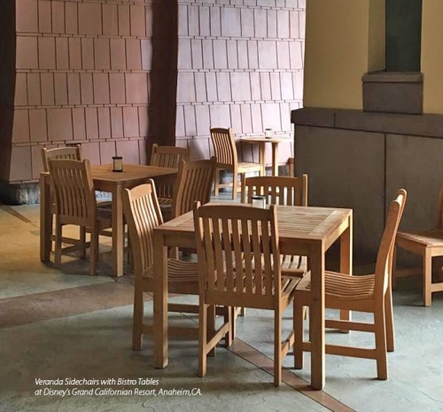 70424 Veranda teak 5 piece square Bistro Set of 4 teak side chairs and 36 inch square dining table on marble floor with other bistro sets in background